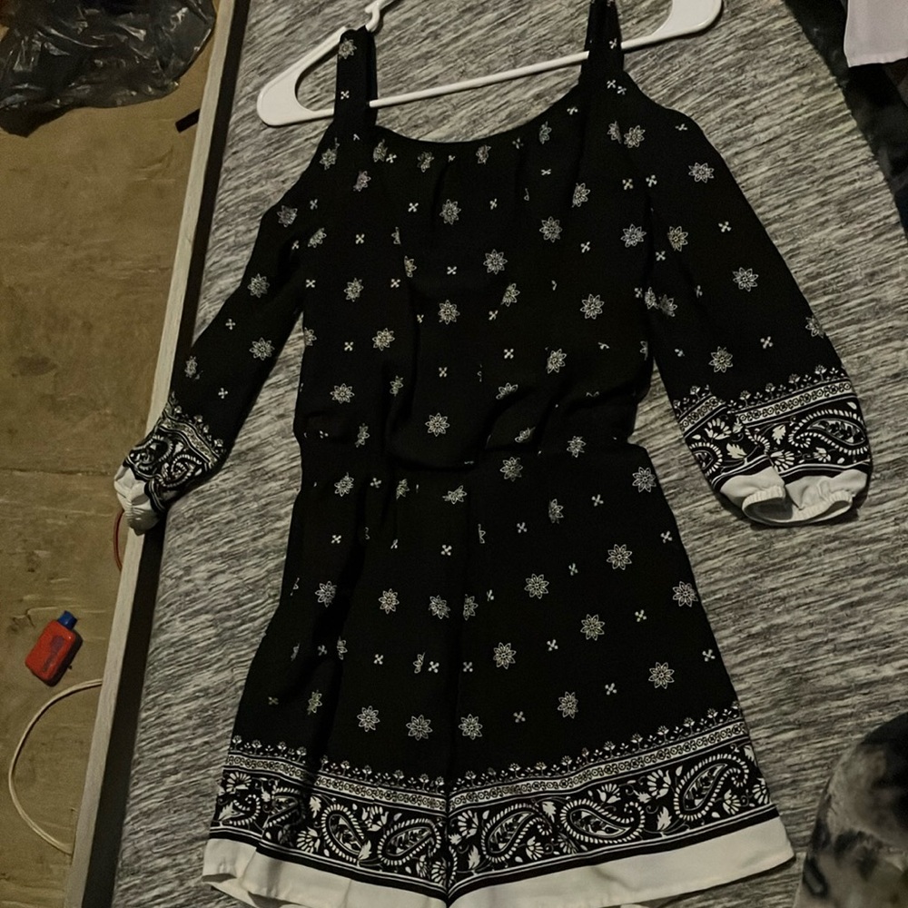 Black and white romper, fits older kids and smaller teens.